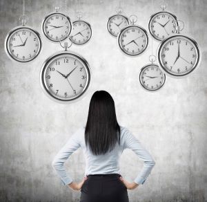 girl looking at clocks